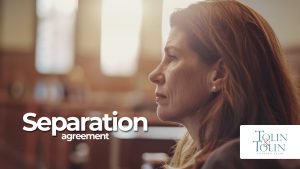 Woman sits in courtroom.